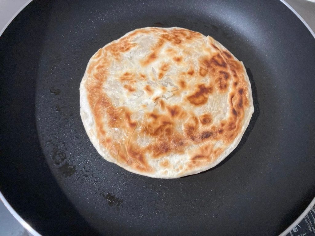 Simply fry frozen Indian Paratha bread with no oil as self it's oiling